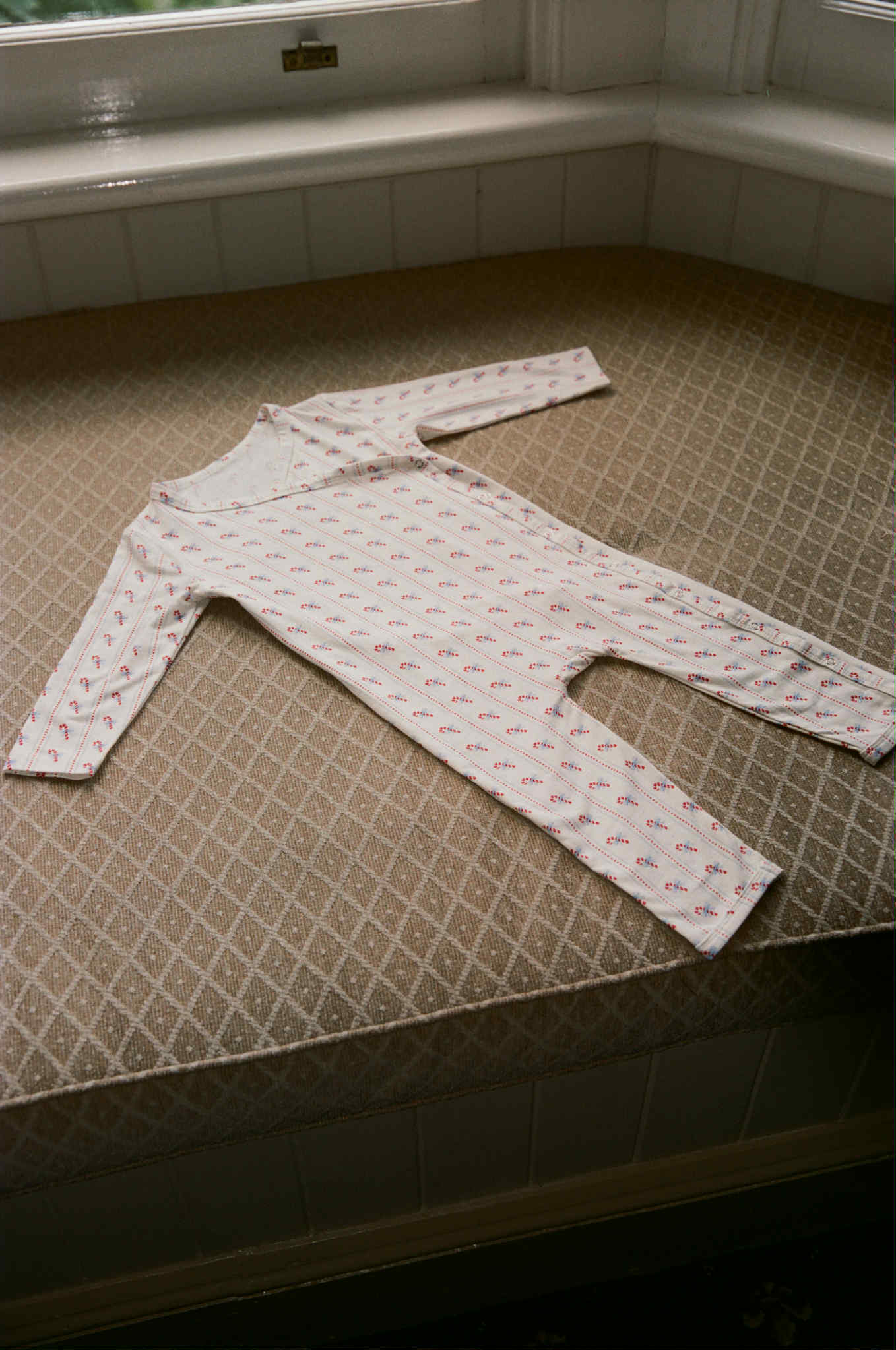 the wholesome store candy pyjama onesie