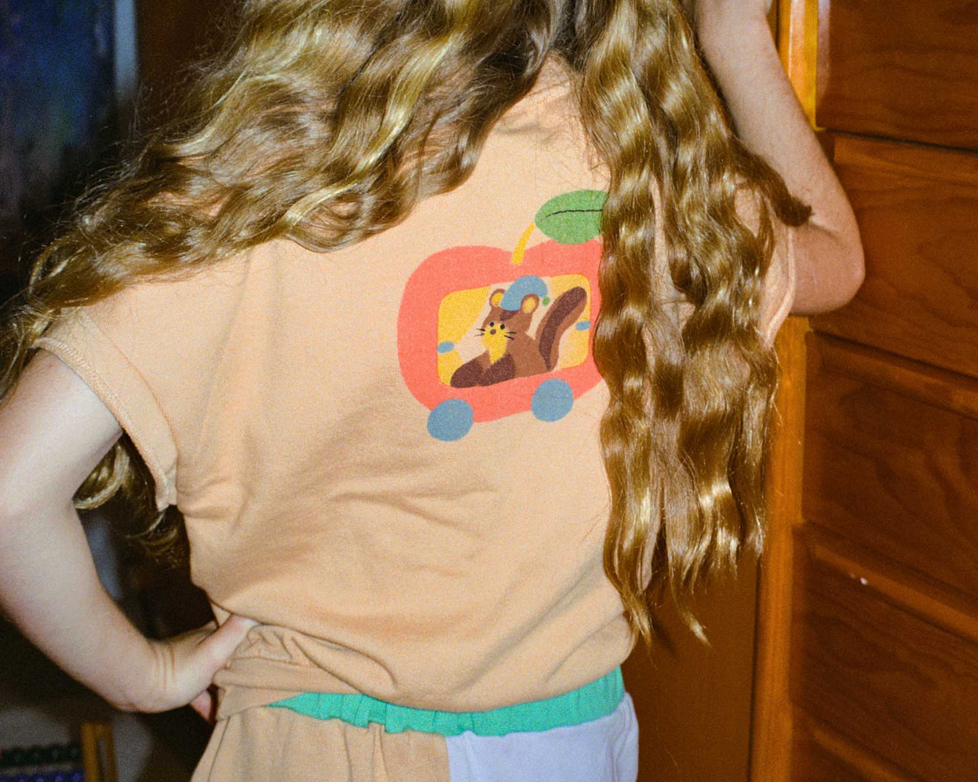 the campamento squirrel in an apple oversized vest