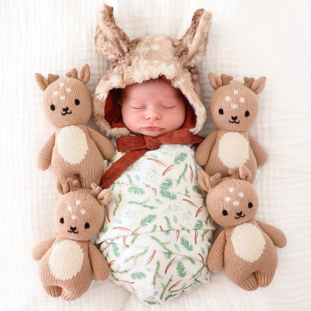 cuddle + kind baby fawn