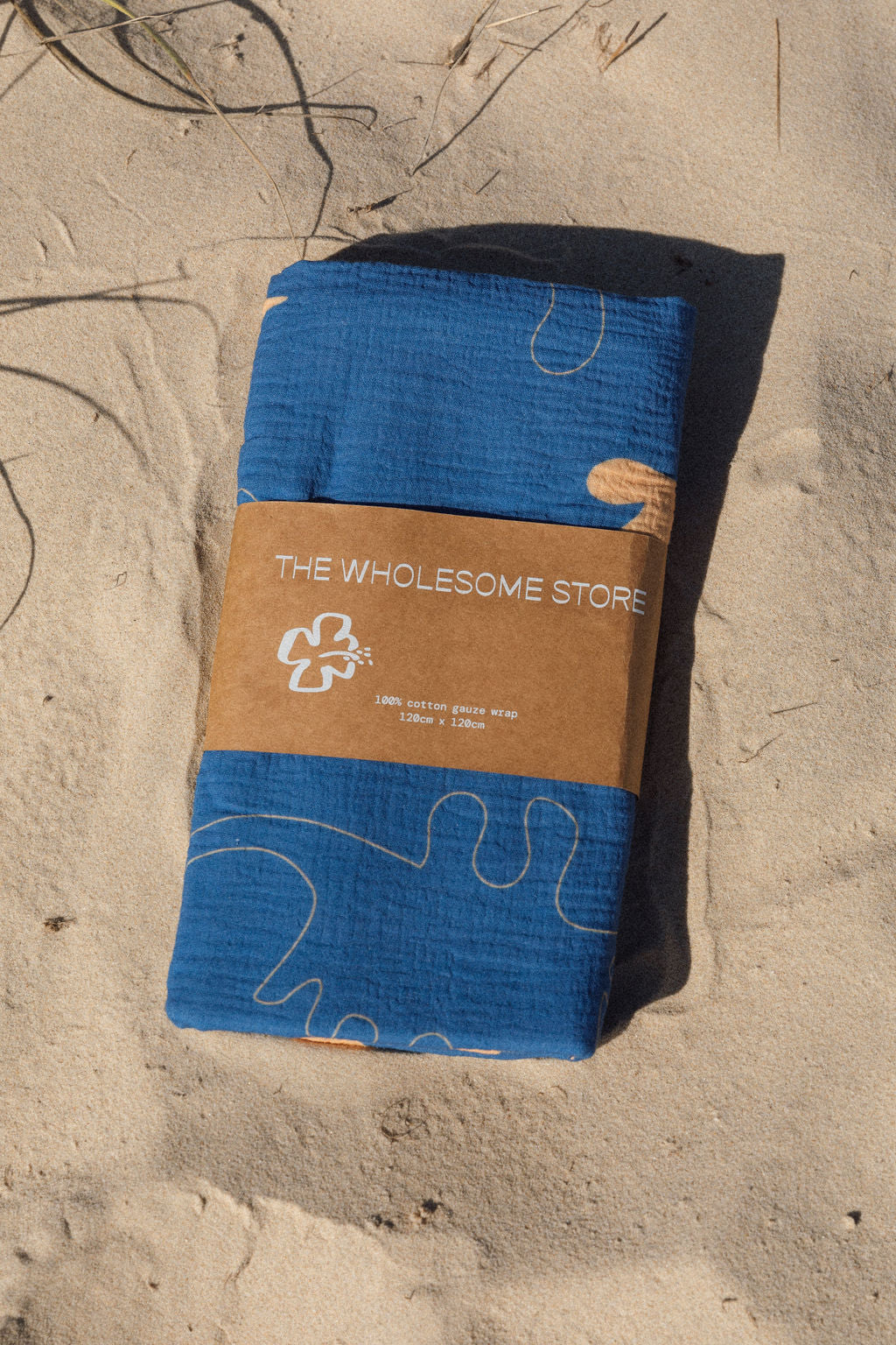 the wholesome store dino swaddle - cobalt