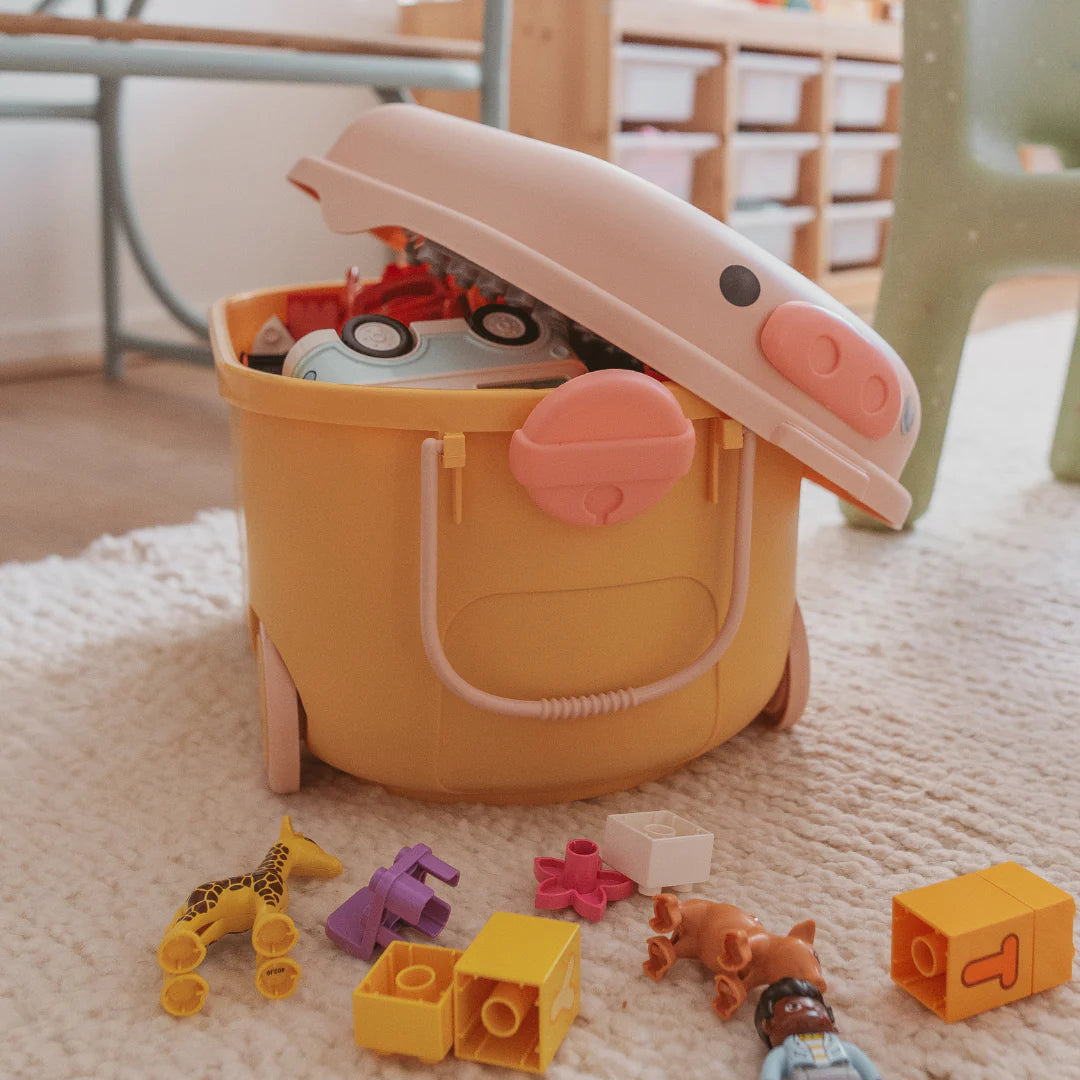 cowrie & conch ride along storage - yellow & pink pig