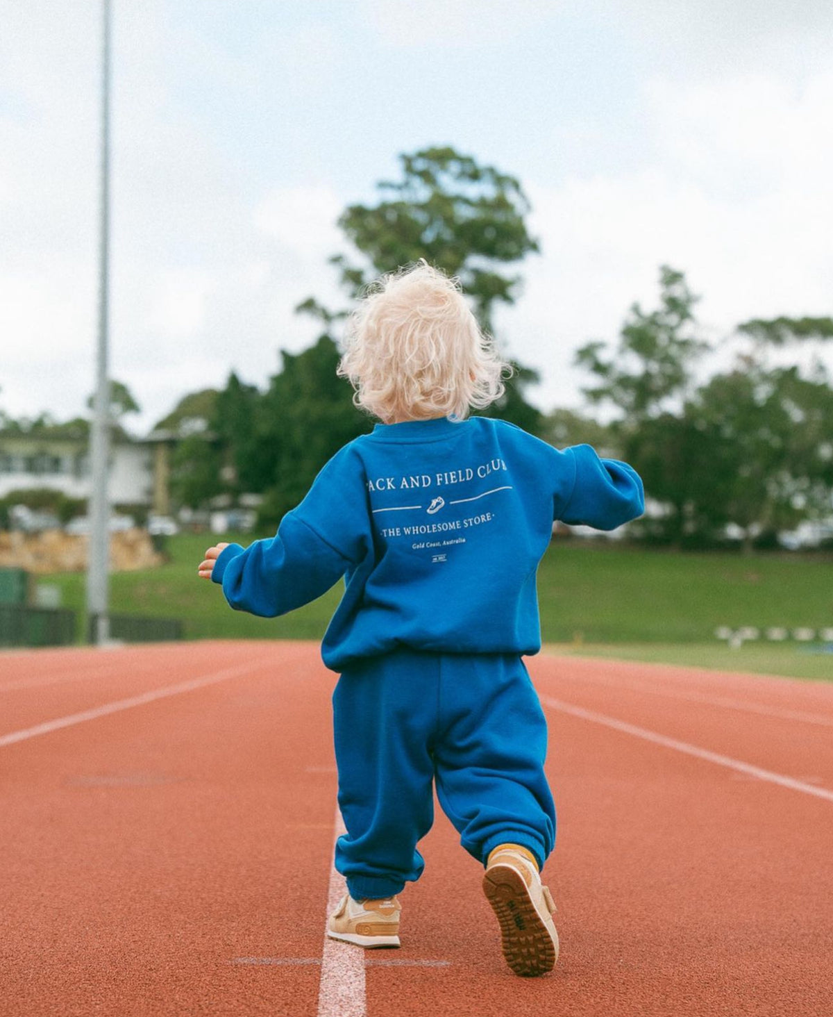 the wholesome store mini track and field sweater
