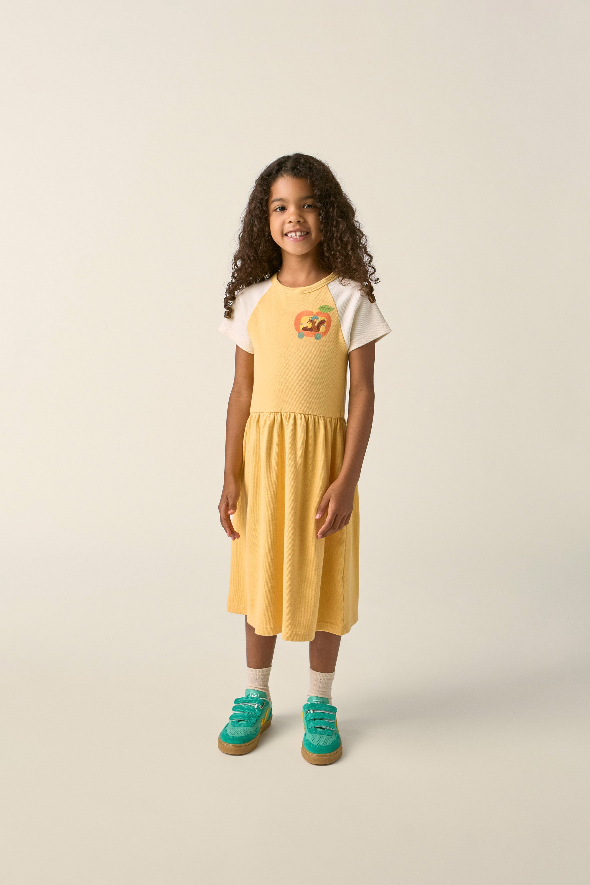 the campamento squirrel in an apple dress