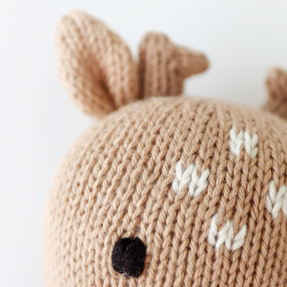 cuddle + kind baby fawn