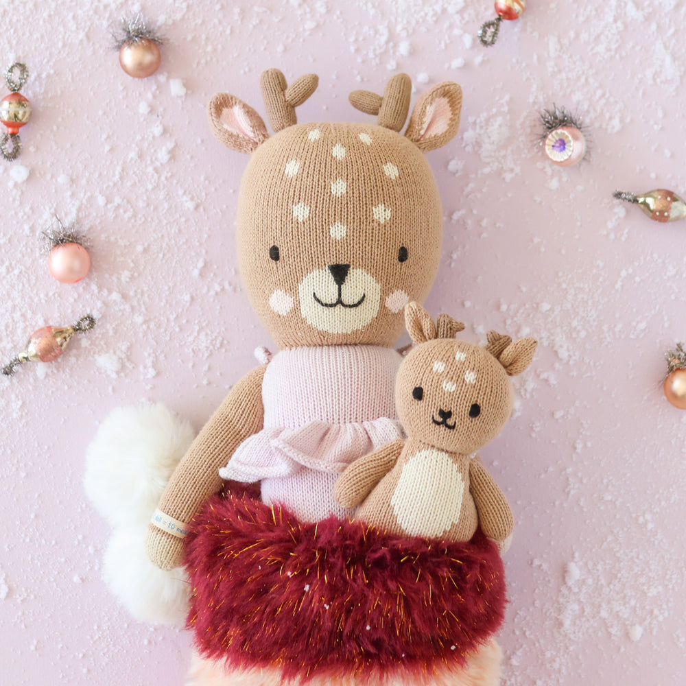 cuddle + kind baby fawn